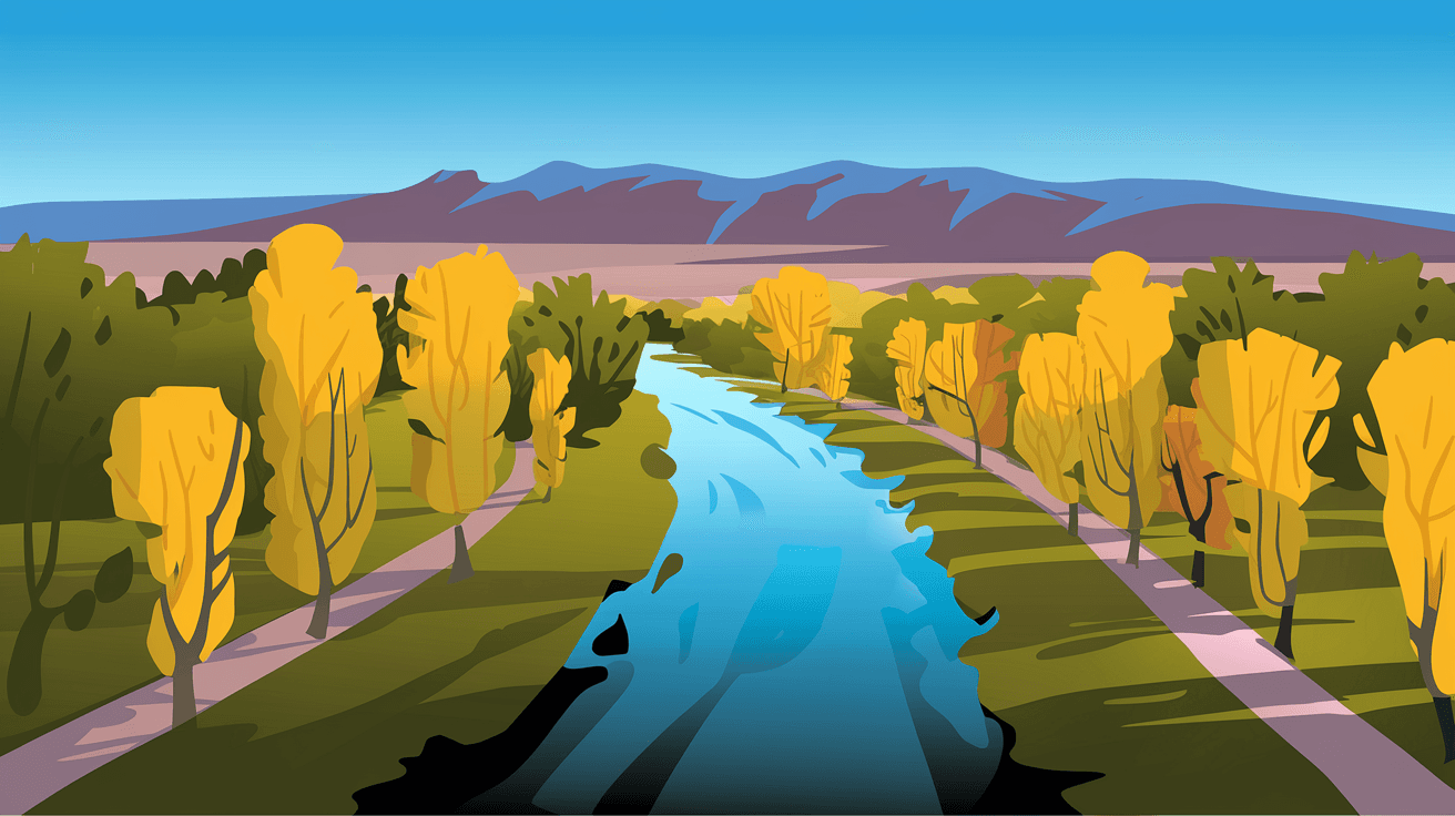 Aerial view of the Paseo del Bosque Trail winding through golden cottonwood trees along the Rio Grande in Albuquerque's North Valley, with the Sandia Mountains visible in the background under a clear blue sky